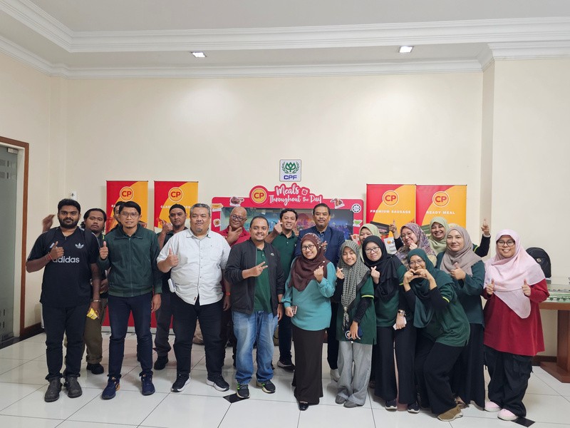 Group photo with event banners