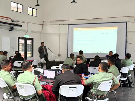 Army officers at their laptops